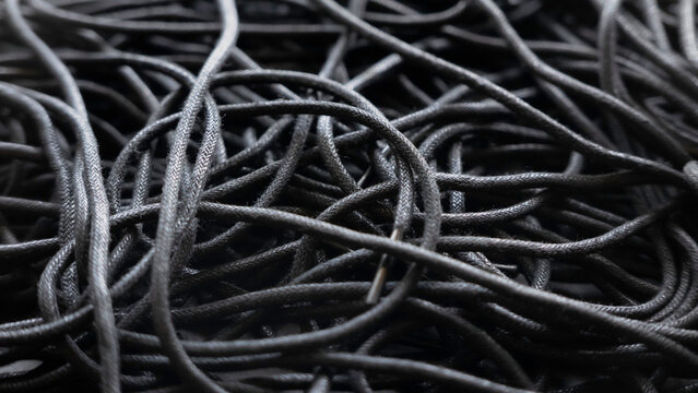 Black Tangled Threads Abstract Texture Pattern Background.A Tangled Of Black Shoelaces Background.