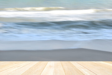 Empty top wooden table on soft focus blurred sea beach for background