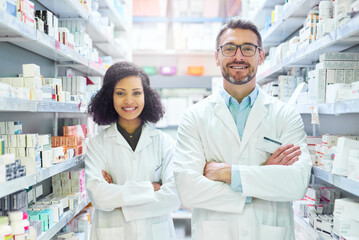 If its good for you, weve got it in stock. Portrait of a confident mature man and young woman working together in a pharmacy.