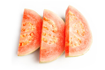Fresh Organic Raw Thai Guava cut in pieces showing red texture on white background
