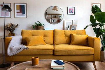 Front view of yellow couch in living room apartment interior.