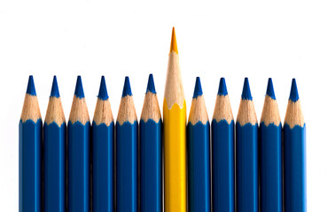 Yellow pencil standing out from the crowd