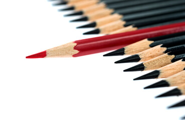 Obraz premium Red pencil standing out from the crowd