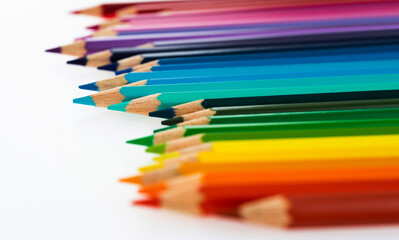A row of colorful pencils on white background