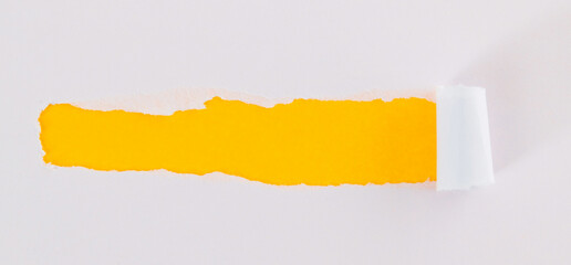 Torn paper on yellow background