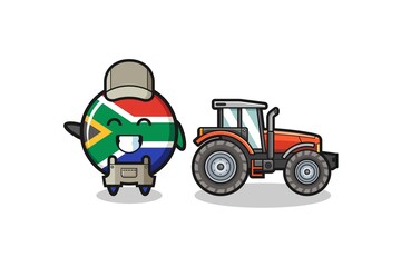 the south africa flag farmer mascot standing beside a tractor