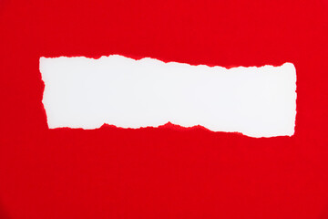 Red torn paper on white background