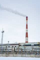 Gas combined heat and power plant with pipes, smoke, steam, power stations.