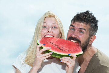 Young couple eating watermelon. Portrait of a young beautiful couple eating watermelon, Happy coupl face.