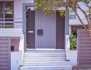 A modern design family house entrance grey painted metallic door, Athens Greece