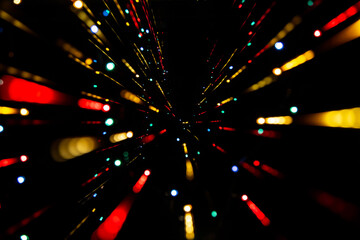 Blur speed effect of colorful lights on black isolated background. Selective focus abstract bursts of light. Party laser light effect. Warp speed effect in space.