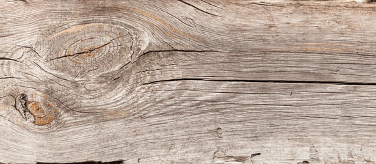 Fototapeta Naturalne tło niejednolitych starych grubych drewnianych desek z teksturą korozji drewna.. Kolory brązu. Tapeta. obraz