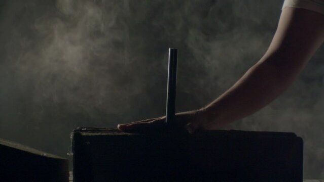 Hammer hitting a big nail in a dramatic misty ambience