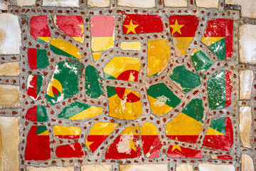 Fototapeta na wymiar National flag of Grenada on stone wall background. Flag banner on stone texture background.