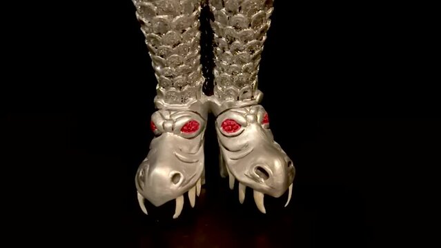 Miniature boots patterned after those worn by Gene Simmons Rock Band KISS - turntable display