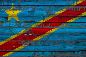The national flag of Democratic Republic of the Congo is painted on uneven boards. Country symbol.
