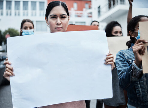 I Stand By My Beliefs. Shot Of A Young Woman Protesting At A Covid Vaccine March.