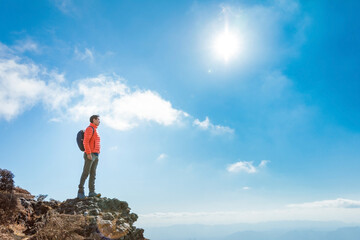 Man in the peak of Mountain Tsurumi, Beppu, Kyushu, Japan