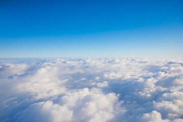 Fototapeta na wymiar cloudscape shot from airplane, over the cloud