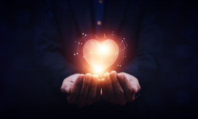 hands holding digital heart on visual screen , health care, love, organ donation,world heart day,...