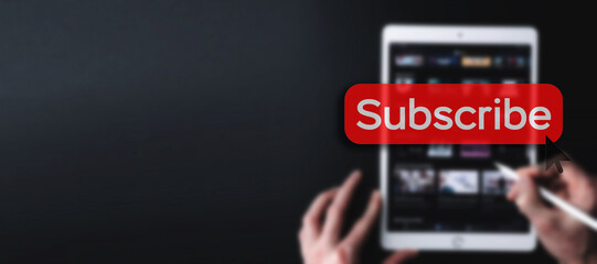 Subscribe button. Online video subscription red button. Internet service on laptop digital tablet blured banner background. Visual contents concept. Social networking service.