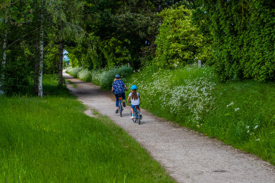 People walking and riding bicycles. Greenway hiking and cycling trail Stratford upon Avon Warwickshire England UK