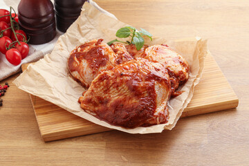 Marinated chicken leg in tomato sauce