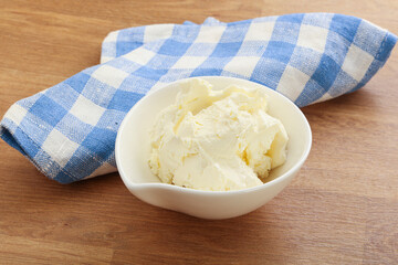 Italian soft mascarpone cheese in the bowl