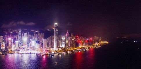Fototapeta na wymiar Amazing night aerial view of cityscape of Victoria Harbour, center of Hong Kong, asia