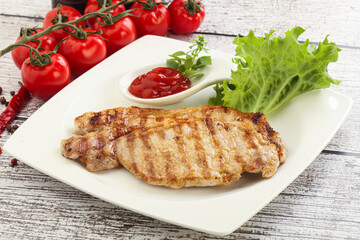 Grilled pork steak with ketchup