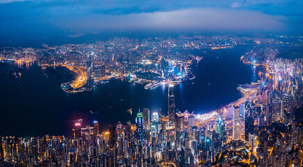 Fototapeta na wymiar Amazing night aerial view of cityscape of Victoria Harbour, center of Hong Kong