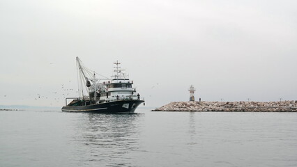 Seaside town and lighthouse in Canakkale, Turkey