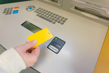Woman's hand holding bank card bank contactless indicator
