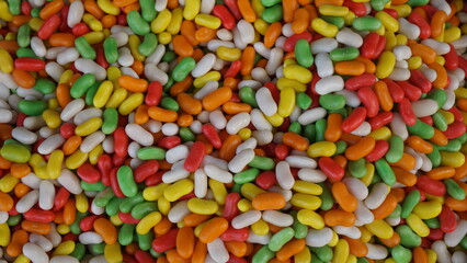 many colored marshmallows, yellow green white red and orange colored