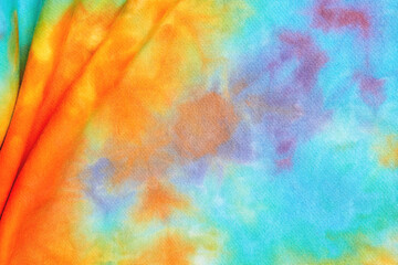 Abstract tie dye multicolor folded fabric cloth Boho pattern texture for background or groovy...