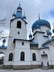 Russian orthodox church, white walls and blue cupolas  © Oksana