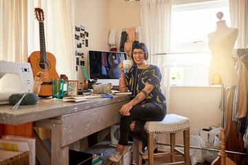Surrounded by her creative endeavors. Portrait of a stylish young designer sitting in her eclectic...
