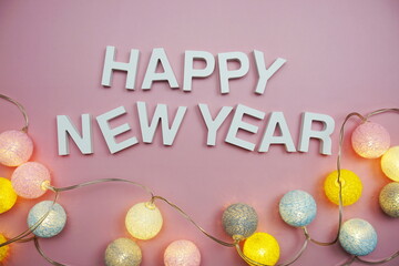 Happy New Year alphabet letters on pink background