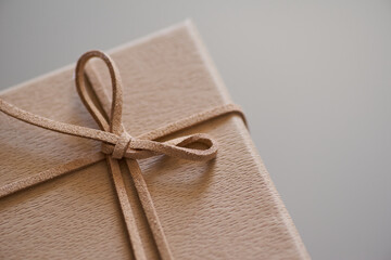 A gift box with leather ribbon