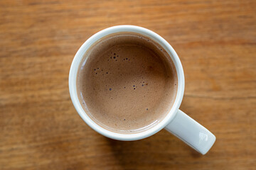cup of coffee on wooden background