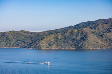 Fototapeta na wymiar Ferry sailing across coastline, sea near Tolo Channel, Hong Kong