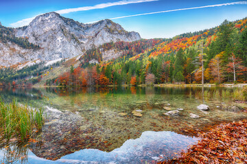 Dramatic autumn scene of Hinterer Langbathsee lake.
