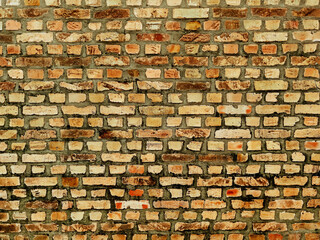 Wall made of old yellow bricks