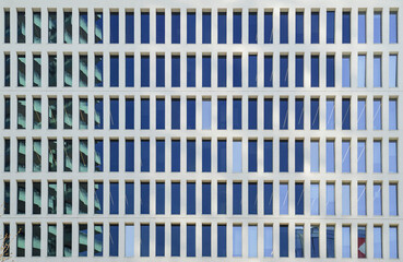 full frame shot of the symmetrical facade of an office building