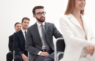 young business woman sitting at conference