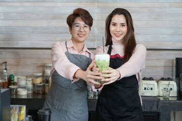 young asian woman LGBTQ lover working together in business owner coffee shop. concept for LGBTQ lifestyle, cohabitation, relationship etc