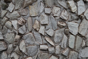 Backdrop - whitish gray gravel pebble dash on the wall