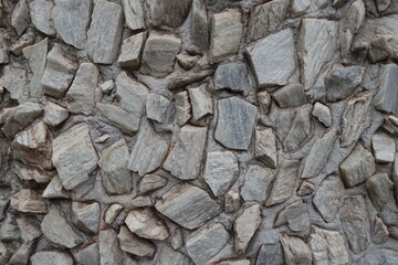 Background - whitish gray gravel pebble dash on the wall