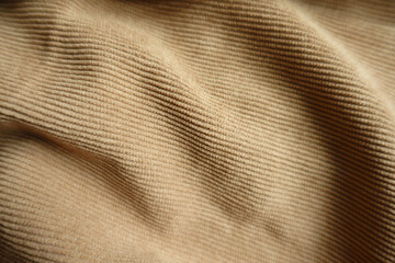 Rippled light brown corduroy fabric from above