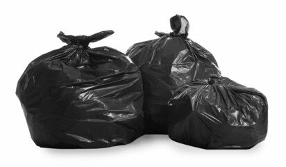 Black trash bags full of garbage on white background